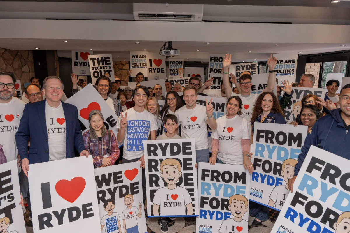 Community campaign group gathered with promotional signs