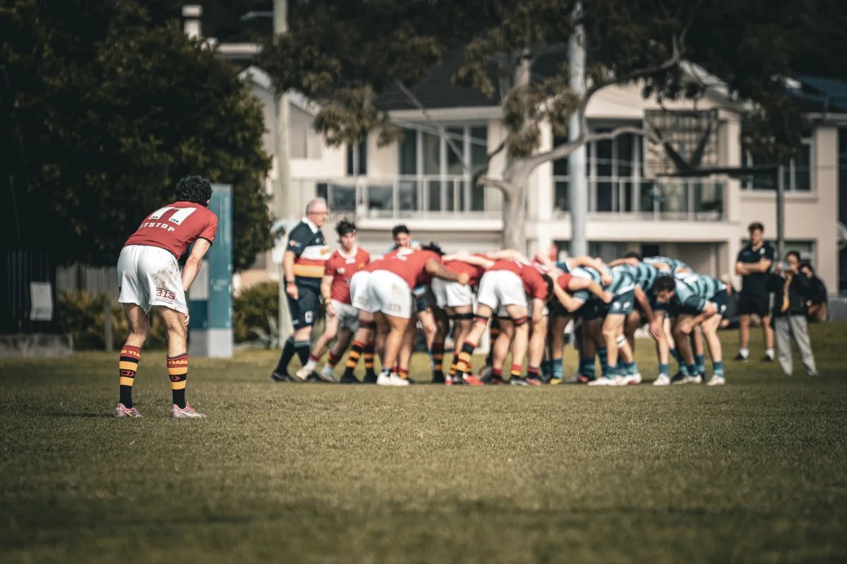 Rugby teams preparing for a scrum during a match
